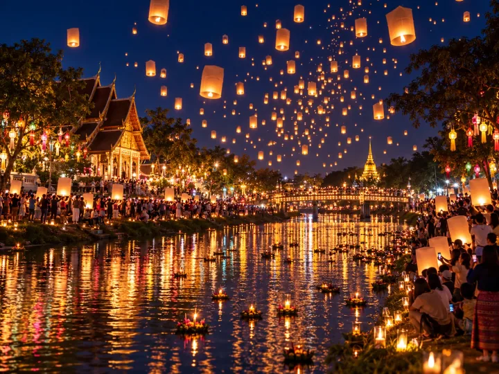 Paper sky lanterns rising over Chiang Mai during Yi Peng in November