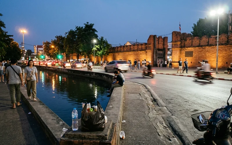 The Old City moat in the evening with lights reflecting on the water