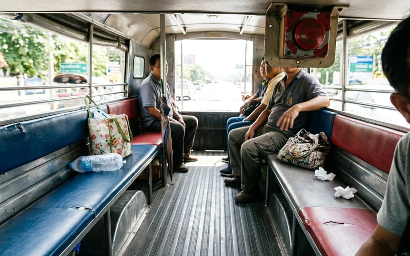 The interior of a songthaew with facing bench seats