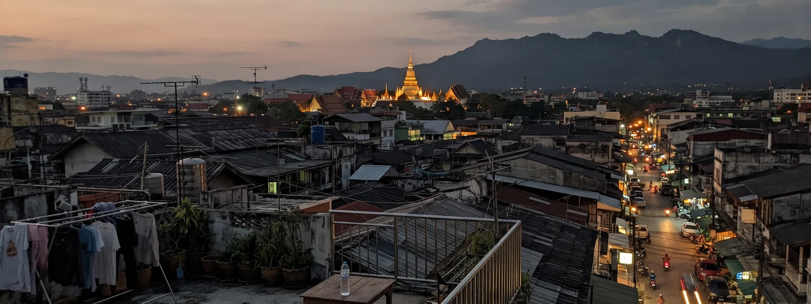 Evening view across Chiang Mai rooftops toward Doi Suthep
